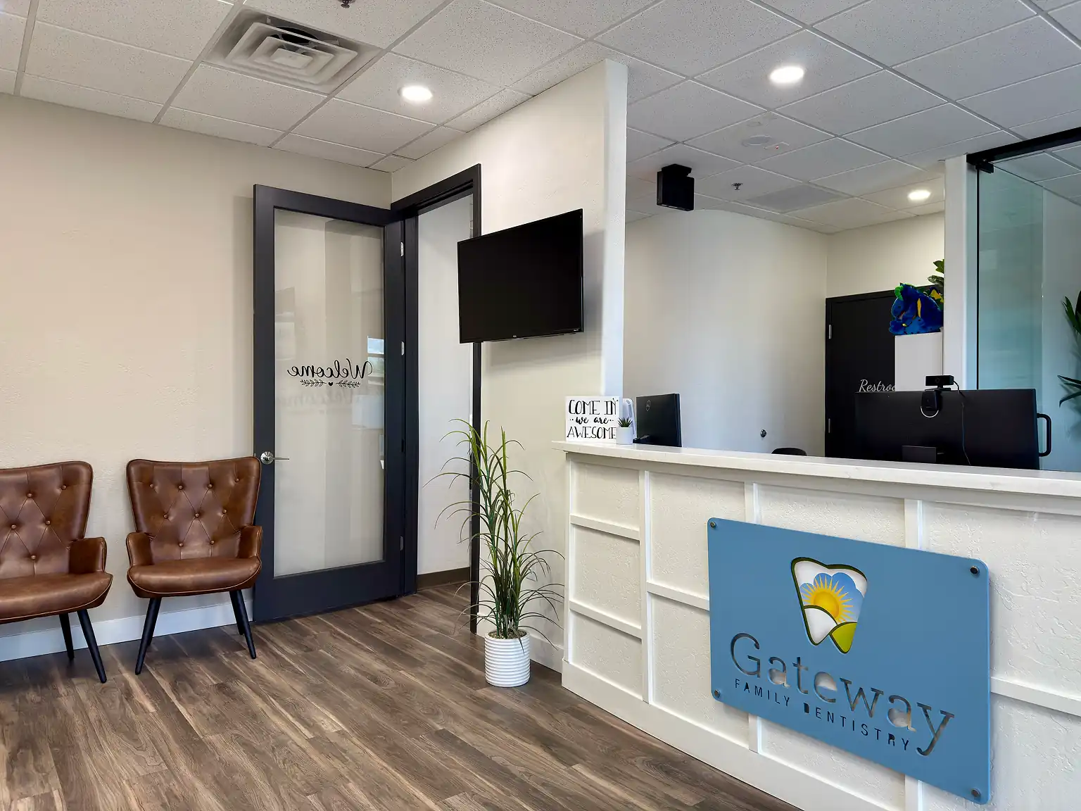 Friendly staff greeting patients at the front desk